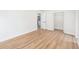 Bedroom features wood floors, white walls, open closet and a doorway at 4812 El Capistrano Dr, Tampa, FL 33634