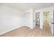 Bright bedroom with light-colored floors, closet, and doorway to the bathroom at 4812 El Capistrano Dr, Tampa, FL 33634