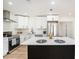 Kitchen features stainless steel appliances, custom cabinets, and a stylish island at 4812 El Capistrano Dr, Tampa, FL 33634