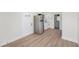 A freshly updated kitchen with stainless steel refrigerator and modern white cabinets at 4812 El Capistrano Dr, Tampa, FL 33634