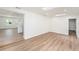 Open floor plan of light, bright living room with light-colored floors at 4812 El Capistrano Dr, Tampa, FL 33634