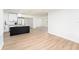 A bright and airy living room with an open floor plan and new flooring at 4812 El Capistrano Dr, Tampa, FL 33634