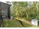 A secluded backyard abuts dense, natural woods at 5619 Essex Ct, Palm Harbor, FL 34685