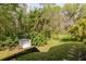 Exterior of the property featuring a shed in the yard, offering practical outdoor storage at 5619 Essex Ct, Palm Harbor, FL 34685