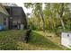 A secluded backyard abuts dense, natural woods and a pool at 5619 Essex Ct, Palm Harbor, FL 34685