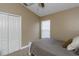 Cozy bedroom with neutral tones, closet, and natural light coming through window at 5619 Essex Ct, Palm Harbor, FL 34685