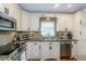 Bright kitchen featuring stainless appliances, tile backsplash, and spacious countertops at 5619 Essex Ct, Palm Harbor, FL 34685