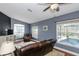 Comfortable living room featuring wood floors, natural light, and a view of the pool at 5619 Essex Ct, Palm Harbor, FL 34685