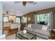 Open living area to the kitchen and dining room with natural light at 5619 Essex Ct, Palm Harbor, FL 34685