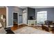 Inviting living room featuring hardwood floors, neutral decor, and a front entry at 5619 Essex Ct, Palm Harbor, FL 34685