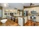 Open concept living area featuring a kitchen, dining, and built-in shelving at 5619 Essex Ct, Palm Harbor, FL 34685