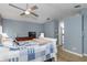Comfortable main bedroom with neutral decor and a view of the en-suite at 5619 Essex Ct, Palm Harbor, FL 34685