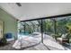 Beautiful screened-in pool and patio area offers relaxing outdoor enjoyment at 5619 Essex Ct, Palm Harbor, FL 34685