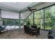 Covered screened patio with lush greenery views offers peaceful outdoor space at 5619 Essex Ct, Palm Harbor, FL 34685