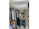Organized walk-in closet with built-in shelving and hanging rods at 5619 Essex Ct, Palm Harbor, FL 34685