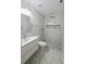 Bathroom with marble tiled shower with unique rock detail at 5817 Liverpool Dr, Tampa, FL 33615