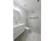 Bathroom with marble tiled shower with unique rock detail at 5817 Liverpool Dr, Tampa, FL 33615