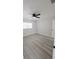 Neutral bedroom featuring light gray wood flooring and a ceiling fan at 5817 Liverpool Dr, Tampa, FL 33615