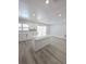 Bright kitchen featuring white cabinetry, quartz countertops, and a stylish backsplash at 5817 Liverpool Dr, Tampa, FL 33615