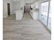 Open living space seamlessly connects to the kitchen, complemented by sliding glass doors to patio and pool at 5817 Liverpool Dr, Tampa, FL 33615