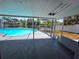 Screened-in pool area with a water view, perfect for relaxing and entertaining at 5817 Liverpool Dr, Tampa, FL 33615