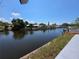 Beautiful water view featuring boat docks and canal access, offering a tranquil waterfront lifestyle at 5817 Liverpool Dr, Tampa, FL 33615