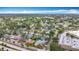 Wide aerial view featuring a residential neighborhood surrounded by trees and community parks under a clear sky at 6350 18Th N Ave, St Petersburg, FL 33710