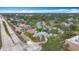 Aerial view displaying a residential area with nearby businesses, tree coverage, and convenient neighborhood streets at 6350 18Th N Ave, St Petersburg, FL 33710