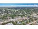 Expansive aerial view showcasing the neighborhood's layout with mature trees and nearby amenities under a bright sky at 6350 18Th N Ave, St Petersburg, FL 33710