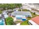 A captivating aerial view showcasing a well-maintained home with a lovely yard and a refreshing pool at 6350 18Th N Ave, St Petersburg, FL 33710