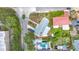 High-angle aerial view of the home showing the backyard pool, landscaping, and layout of the property at 6350 18Th N Ave, St Petersburg, FL 33710