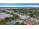 Scenic aerial view capturing the neighborhood with tree-lined streets and well-maintained homes under a blue sky at 6350 18Th N Ave, St Petersburg, FL 33710