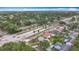 Lush aerial shot of the neighborhood displaying tree-lined streets and single Gathering homes under clear blue skies at 6350 18Th N Ave, St Petersburg, FL 33710