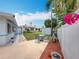 View of the backyard with the covered patio and outdoor table set at 6350 18Th N Ave, St Petersburg, FL 33710