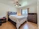 Well-lit bedroom with dark furniture and a ceiling fan at 6350 18Th N Ave, St Petersburg, FL 33710