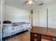 Bright bedroom with wood floors, ceiling fan and a closet for storage at 6350 18Th N Ave, St Petersburg, FL 33710