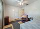 This comfortable bedroom has a ceiling fan and wood floors at 6350 18Th N Ave, St Petersburg, FL 33710