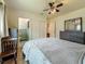 Bedroom with dark furniture and closet and bathroom view at 6350 18Th N Ave, St Petersburg, FL 33710