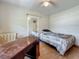 Bright bedroom with wood floors, ceiling fan and a large desk perfect for work or study at 6350 18Th N Ave, St Petersburg, FL 33710