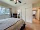 Cozy bedroom featuring a ceiling fan, window and a closet, creating a comfortable and functional living space at 6350 18Th N Ave, St Petersburg, FL 33710