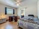 Charming bedroom features wood floors, natural light from a window, and a ceiling fan for comfortable living at 6350 18Th N Ave, St Petersburg, FL 33710