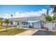 Inviting single-Gathering home featuring a well-kept lawn, shade awning, and a private driveway at 6350 18Th N Ave, St Petersburg, FL 33710
