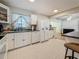 Bright kitchen featuring white cabinets, tile floors, and modern appliances at 6350 18Th N Ave, St Petersburg, FL 33710