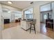 Cozy kitchen featuring white cabinets, bar stool seating, and an open layout at 6350 18Th N Ave, St Petersburg, FL 33710