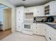 Bright kitchen with white cabinets, tile floors, and modern appliances at 6350 18Th N Ave, St Petersburg, FL 33710