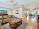 Bright open-concept living area with hardwood floors connected to the kitchen and dining room at 6350 18Th N Ave, St Petersburg, FL 33710