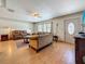 Bright living room featuring hardwood floors, neutral paint, updated ceiling fan and a decorative front door at 6350 18Th N Ave, St Petersburg, FL 33710