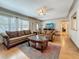 Inviting living room featuring hardwood floors, ceiling fan, and cozy furniture arrangement at 6350 18Th N Ave, St Petersburg, FL 33710