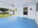 Covered patio with painted concrete floor, ceiling fan, and backyard view at 6350 18Th N Ave, St Petersburg, FL 33710