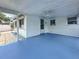 Covered patio with painted concrete floor, ceiling fan, and views of the backyard at 6350 18Th N Ave, St Petersburg, FL 33710